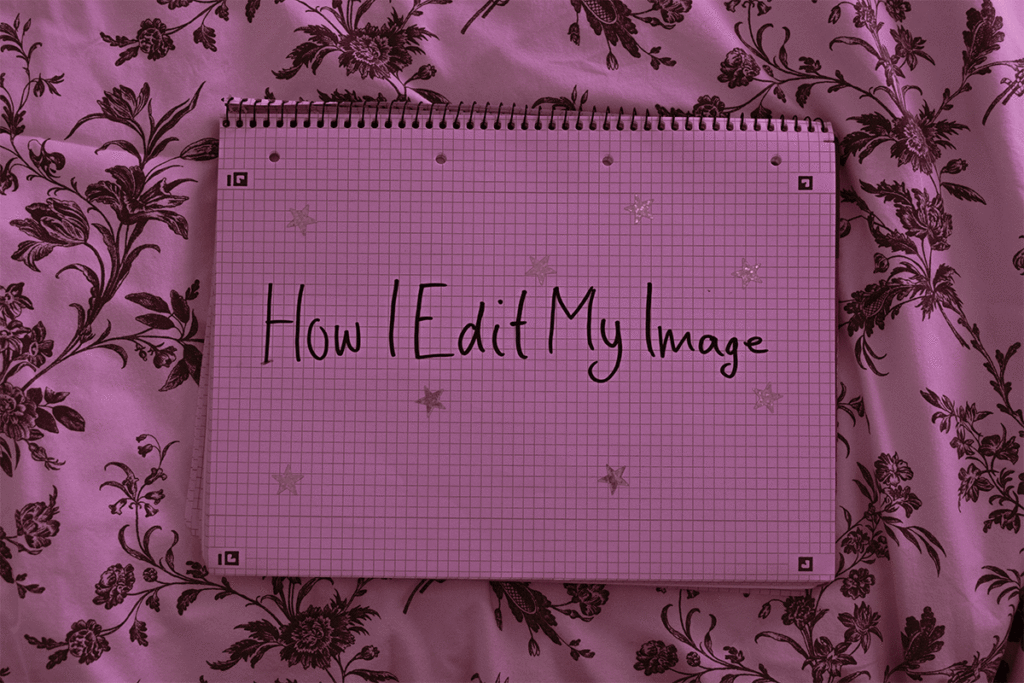 A notebook on a floral bedsheet with the handwritten title “How I Edit My Image.”