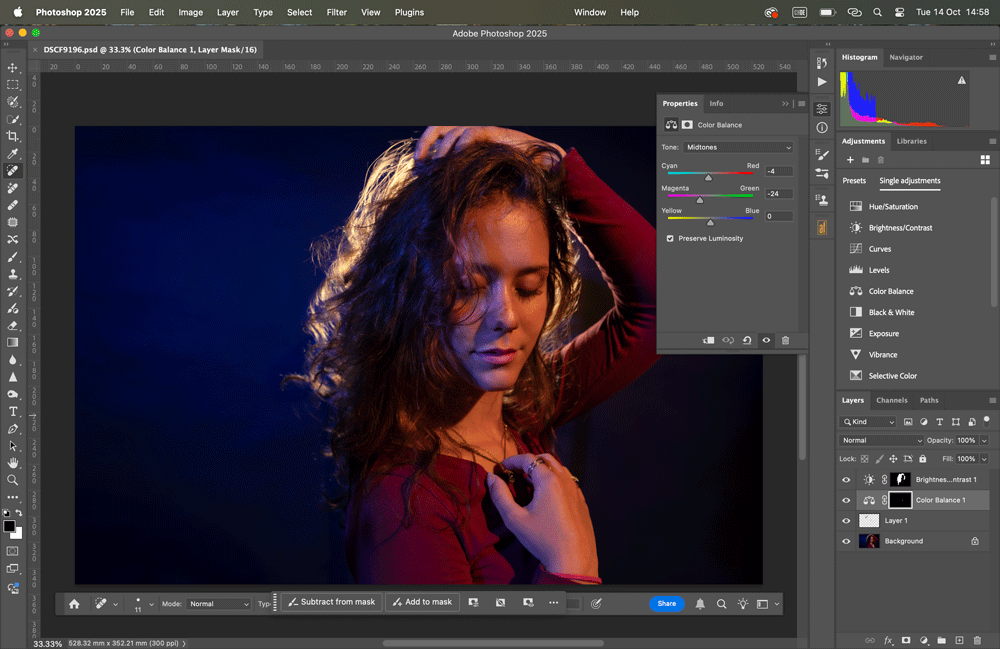 A computer screen showing a portrait photo being edited in Adobe Photoshop, with color balance adjustments applied.
